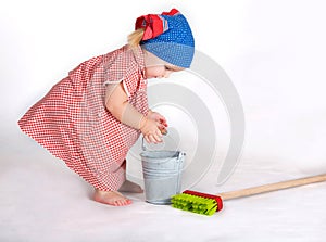 Child girl housewife cleaner