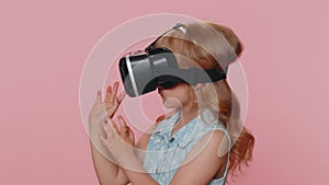 Child girl kid using virtual reality VR app headset to play simulation 3D video game watching video