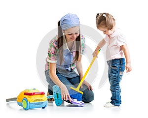 Child girl and mom cleaning room