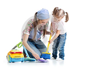 Child girl and mother sweep floor