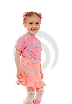 Child girl pink T-shirt skirt fun smiling face studio portrait