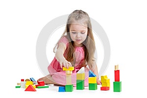 Child girl playing with block toys