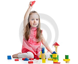 Child girl playing with block toys