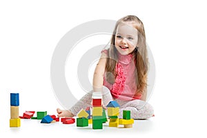 Child girl playing with block toys