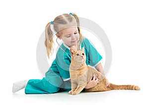 Child girl playing doctor with cat