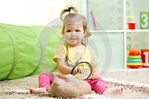 Child Girl Playing Doctor With A Cat