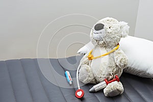 Child girl playing doctor with a toy. Rescuing of endangered animals