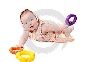 Child girl playing with toy pyramid build from rings isolated