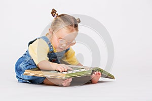 Child girl reading book