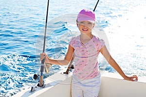 Child girl sailing in fishing boat holding rod