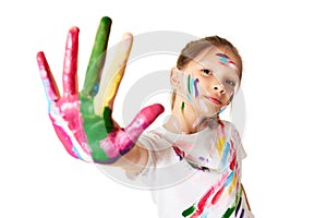 child girl showing hands painted in colorful paint