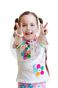 Child girl showing victory hand sign on white
