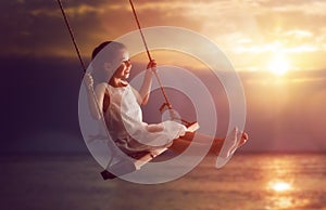 Child girl on swing