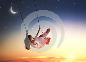 Child girl on swing