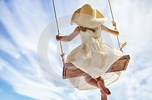 Child girl on swing