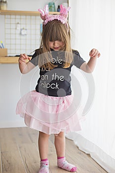 Child girl wearing a ballerina costume and antennas