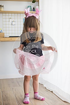 Child girl wearing a ballerina costume and antennas