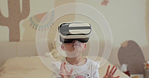 Child girl wearing virtual reality headset interacting with digital world, curious kid exploring universe with vr