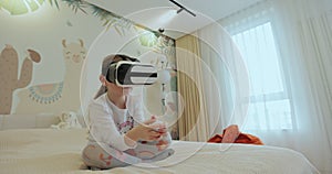 Child girl wearing virtual reality headset interacting with digital world, curious kid exploring universe with vr