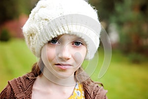 Child girl in white cap, close-up portrait