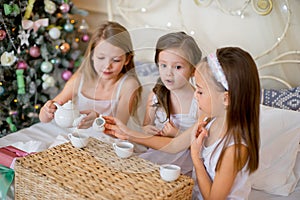 Child girls wake up in her bed in Christmas morning