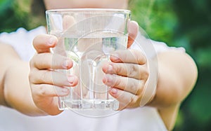 Child glass of water. selective focus. food and drink