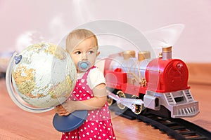 Child with globe wants trip on train