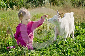 A child with a goat