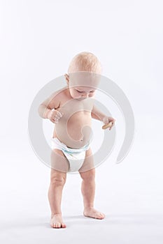 Child goes and plays in diapers