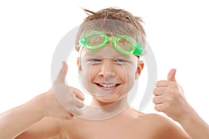 Child with goggles and thumbs up