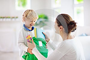 Child going back to school. Mother and kid