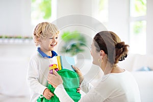 Child going back to school. Mother and kid