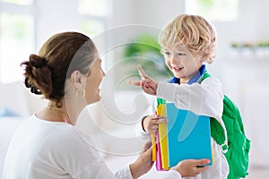 Child going back to school. Mother and kid