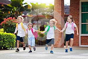 Child going back to school. Start of new school year after summer vacation. Little girl with backpack and books on first school