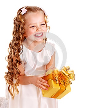 Child with gold gift box on birthday.