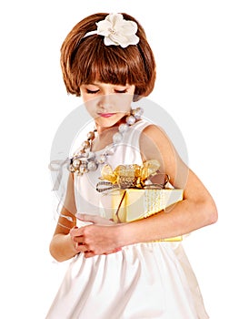Child with gold gift box on birthday.