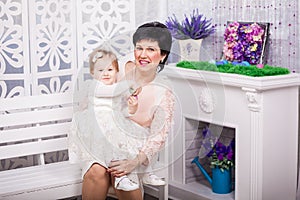 Child and grandmother with Easter eggs