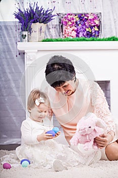 Child and grandmother with Easter eggs