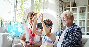Child with grandparents wearing VR Virtual Reality Headset with Interface