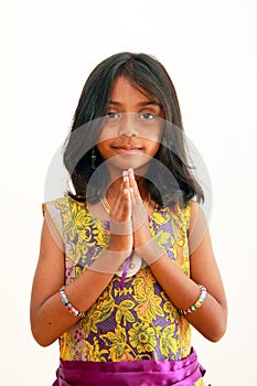 Child greeting with a traditional indian welcome