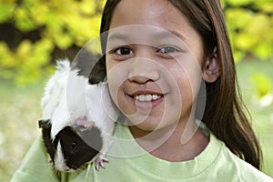 Child with guinea pigs