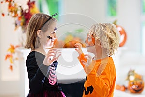 Child in Halloween costume. Kids trick or treat