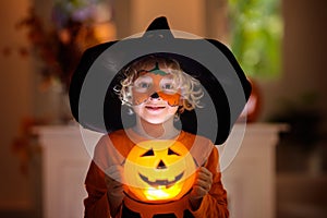 Child in Halloween costume. Kids trick or treat