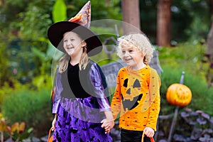 Child in Halloween costume. Kids trick or treat