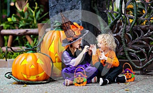 Child in Halloween costume. Kids trick or treat