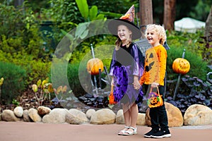 Child in Halloween costume. Kids trick or treat