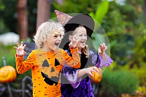 Child in Halloween costume. Kids trick or treat