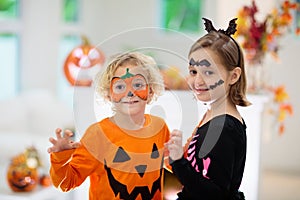Child in Halloween costume. Kids trick or treat