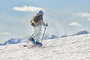 Child halls with mountaineering skis and seal skins photo
