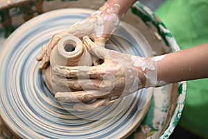 Child hand do ceramics photo